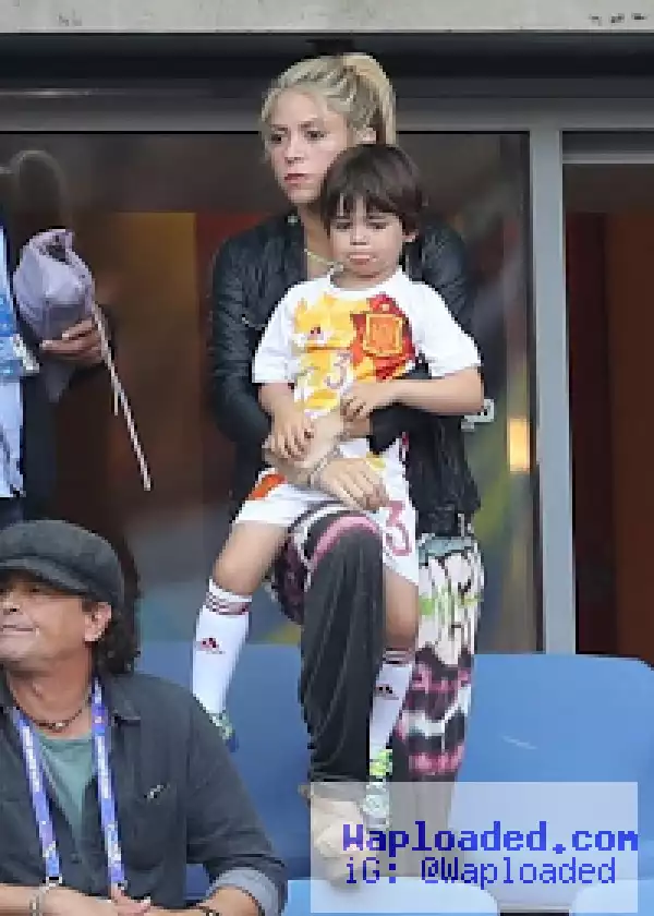 Shakira and sons cheers on her husband football star Gerard Pique during his game.